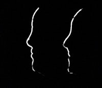 two silhouettes of a man and a woman on a black background