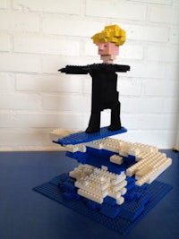 a lego figure on a surfboard