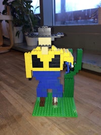 a lego model of a cowboy in a cowboy hat